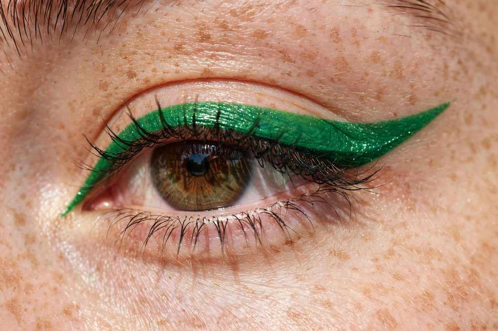 Vibrant emerald green colored winged eyeliner